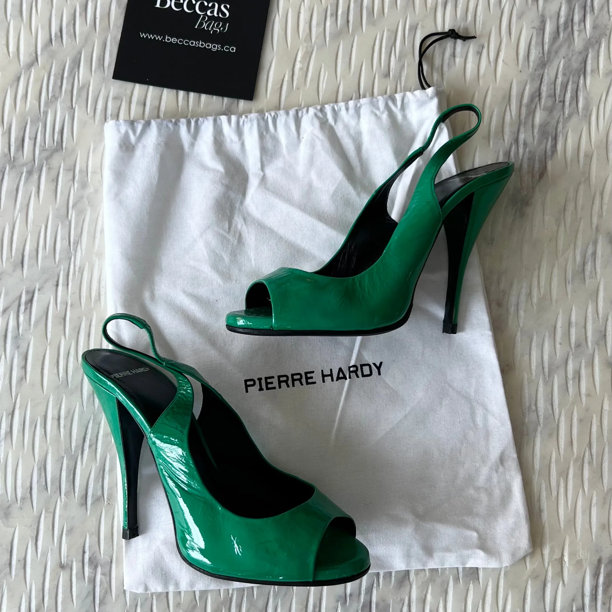 PIERRE HARDY
Green Patent Kidskin Peep
Toe Sling Back Pumps