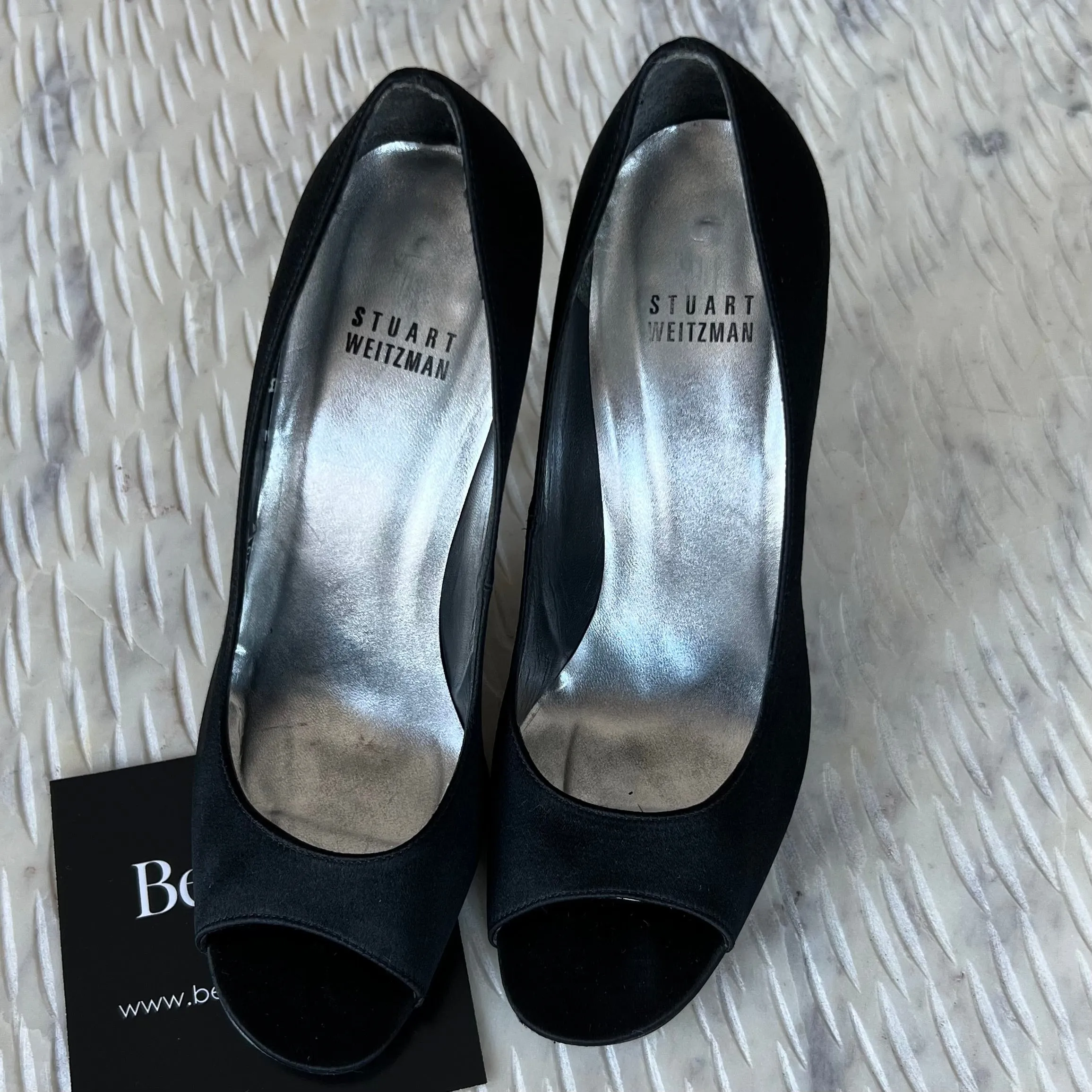STUART
WEITZMAN
Black Satin Crystal Heel Peep Toe Pumps