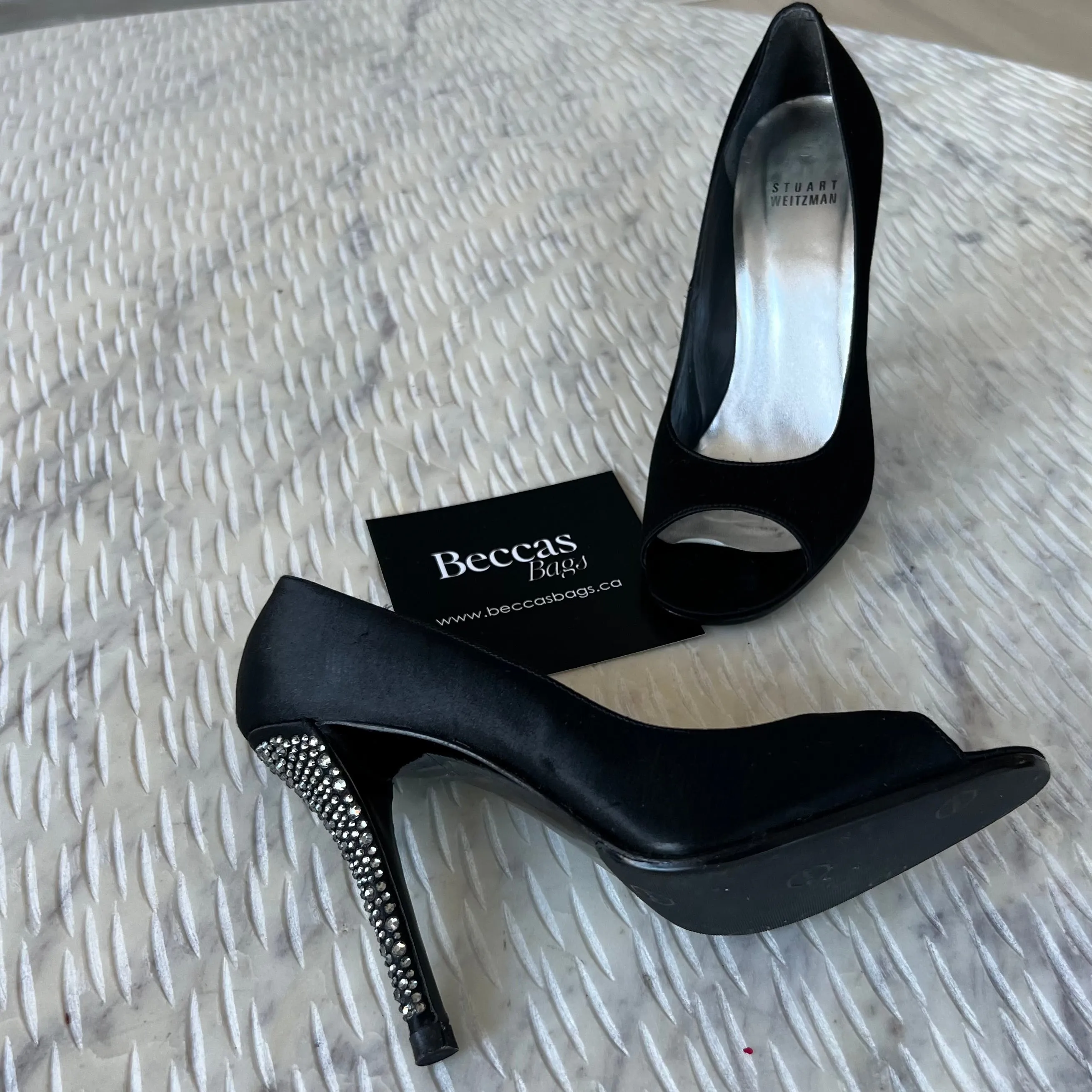 STUART
WEITZMAN
Black Satin Crystal Heel Peep Toe Pumps